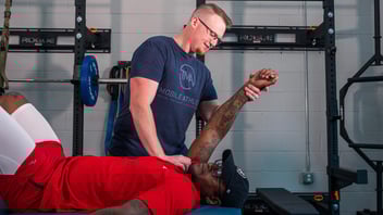 physical therapist performing shoulder mobilization