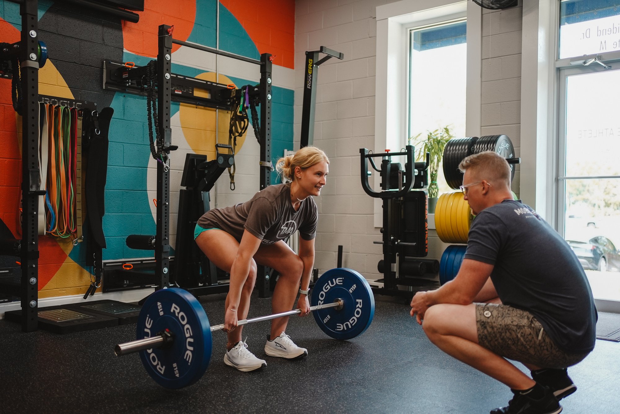 Physical therapist performing movement assessment with athlete at The Mobile Athlete clinic in Peachtree City, Georgia Physical therapist performing movement assessment with athlete at The Mobile Athlete clinic in Peachtree City, Georgia