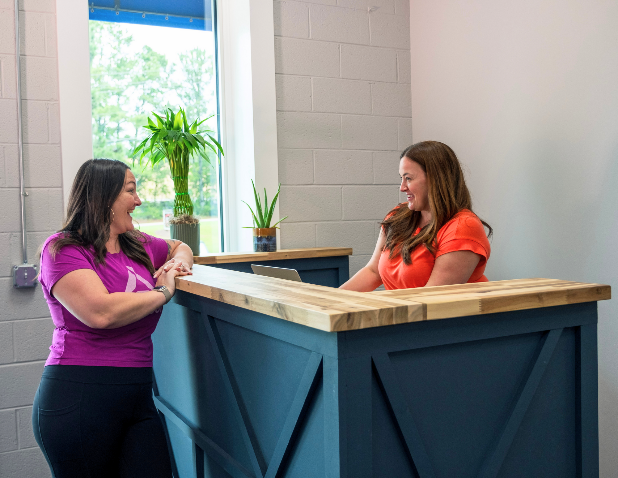 2 ladies at reception desk